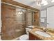 Bathroom with granite vanity and walk-in shower at 4621 Gulf Of Mexico Dr # D10, Longboat Key, FL 34228