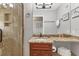 Granite-topped bathroom vanity and walk-in shower at 4621 Gulf Of Mexico Dr # D10, Longboat Key, FL 34228