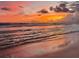 Serene sunrise over the ocean with a bird in flight and gentle waves at 4621 Gulf Of Mexico Dr # D10, Longboat Key, FL 34228