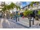 Building exterior with palm trees and patio seating at 4621 Gulf Of Mexico Dr # D10, Longboat Key, FL 34228