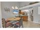 Open kitchen with granite countertops and wood cabinets at 4621 Gulf Of Mexico Dr # D10, Longboat Key, FL 34228