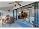 Spacious lanai with sliding glass doors, wicker furniture, and view of kitchen at 4621 Gulf Of Mexico Dr # D10, Longboat Key, FL 34228