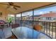 Relaxing screened lanai with outdoor seating and a view of tropical landscape at 4621 Gulf Of Mexico Dr # D10, Longboat Key, FL 34228