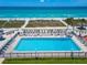 Inviting pool area with ocean views and plenty of lounge chairs at 4621 Gulf Of Mexico Dr # D10, Longboat Key, FL 34228