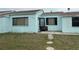 Light blue single story home with small front yard at 205 163Rd Ave, Redington Beach, FL 33708