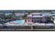 Pink clubhouse with pool and waterfront access at 239 Seahorse Se Dr # B, St Petersburg, FL 33705