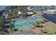 Tennis and pickleball courts near a lake at 239 Seahorse Se Dr # B, St Petersburg, FL 33705