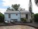 Charming home with a wooden deck and a light blue exterior at 3246 Prescott N St, St Petersburg, FL 33713
