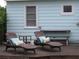 Wooden deck with lounge chairs and a light blue house exterior at 3246 Prescott N St, St Petersburg, FL 33713