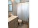 Gray vanity and tiled floor in this updated bathroom at 3246 Prescott N St, St Petersburg, FL 33713