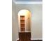 A hallway with dark hardwood floors and an arched entryway at 3246 Prescott N St, St Petersburg, FL 33713