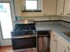 Stainless steel range, backsplash and wood floor at 3246 Prescott N St, St Petersburg, FL 33713