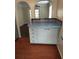 Retro kitchen features a blue countertop, white cabinets, and arched doorways at 3246 Prescott N St, St Petersburg, FL 33713