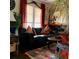 Living room featuring a black leather couch, colorful rug, and a unique style at 3246 Prescott N St, St Petersburg, FL 33713