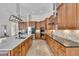 Gourmet kitchen featuring a large island, stainless steel appliances, and custom cabinetry at 4825 Benito Ct, Bradenton, FL 34211