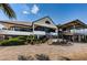 Community clubhouse with patio, landscaping, and water views at 5940 Pelican Bay S Plz # 1106, Gulfport, FL 33707