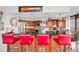 Modern kitchen with breakfast bar, stainless steel appliances, and granite countertops at 5940 Pelican Bay S Plz # 1106, Gulfport, FL 33707