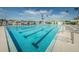 Inviting community pool with lounge chairs and waterfront access at 5940 Pelican Bay S Plz # 1106, Gulfport, FL 33707