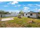 Large backyard with patio, stepping stones, and grassy area at 6318 S Renellie Ct, Tampa, FL 33616