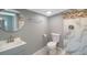 Updated bathroom with walk-in shower and gray vanity at 6318 S Renellie Ct, Tampa, FL 33616