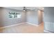 Light gray walls, hardwood floors, ceiling fan, and window at 6318 S Renellie Ct, Tampa, FL 33616