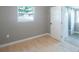 Light and airy bedroom with barn doors and wood-look floors at 6318 S Renellie Ct, Tampa, FL 33616