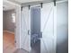 White barn doors opening to a spacious storage closet at 6318 S Renellie Ct, Tampa, FL 33616