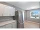 Modern kitchen with stainless steel appliances and white cabinets at 6318 S Renellie Ct, Tampa, FL 33616