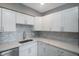 Modern kitchen with white cabinets and quartz countertops at 6318 S Renellie Ct, Tampa, FL 33616