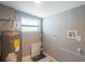 Laundry room with linoleum flooring and water heater at 6318 S Renellie Ct, Tampa, FL 33616