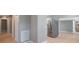 Light gray walls, hardwood floors, ceiling fan, and hallway at 6318 S Renellie Ct, Tampa, FL 33616