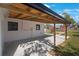 Covered patio with concrete flooring and wooden beams at 6318 S Renellie Ct, Tampa, FL 33616