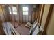 Under construction interior room with exposed framing and new flooring at 12403 Banbury Ave, New Port Richey, FL 34654