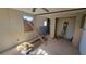 Under construction interior room with exposed framing and new flooring at 12403 Banbury Ave, New Port Richey, FL 34654