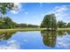Peaceful reflection of the sky on a serene lakefront golf course at 16920 Villalagos De Avila, Lutz, FL 33548