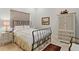 Charming bedroom with a metal bed frame and ample closet space at 16920 Villalagos De Avila, Lutz, FL 33548