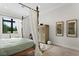 Serene bedroom with a four-poster bed and tranquil view at 16920 Villalagos De Avila, Lutz, FL 33548