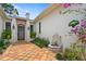 Elegant front entrance with fountain and terracotta tile at 16920 Villalagos De Avila, Lutz, FL 33548