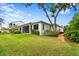 White house exterior with landscaped yard and walkway at 16920 Villalagos De Avila, Lutz, FL 33548