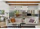 Open concept kitchen with island, stainless steel appliances, and exposed beams at 16920 Villalagos De Avila, Lutz, FL 33548