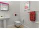 Stylish powder room with a pedestal sink and modern fixtures at 16920 Villalagos De Avila, Lutz, FL 33548