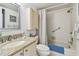 Clean bathroom with shower/tub combo and granite countertop at 6180 Sun Blvd # 201, St Petersburg, FL 33715