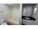 Clean bathroom with a bathtub, shower, and vanity at 2015 59Th S Cir, St Petersburg, FL 33712