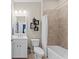 Clean bathroom with a white vanity, tub, and tiled shower at 20644 Swallow Tail Ct, Venice, FL 34293