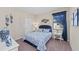 Cozy bedroom with a queen-size bed and blue and white bedding at 20644 Swallow Tail Ct, Venice, FL 34293