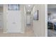 Bright hallway with neutral walls and tile flooring, leading to other rooms at 20644 Swallow Tail Ct, Venice, FL 34293