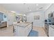 Modern kitchen with an island, stainless steel appliances, and white cabinets at 20644 Swallow Tail Ct, Venice, FL 34293