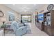 Relaxing living room with a view of the lanai and plenty of natural light at 20644 Swallow Tail Ct, Venice, FL 34293