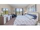 Main bedroom with a king-size bed and water view at 20644 Swallow Tail Ct, Venice, FL 34293