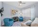 Cozy sitting room featuring comfortable armchairs and a sofa at 20644 Swallow Tail Ct, Venice, FL 34293